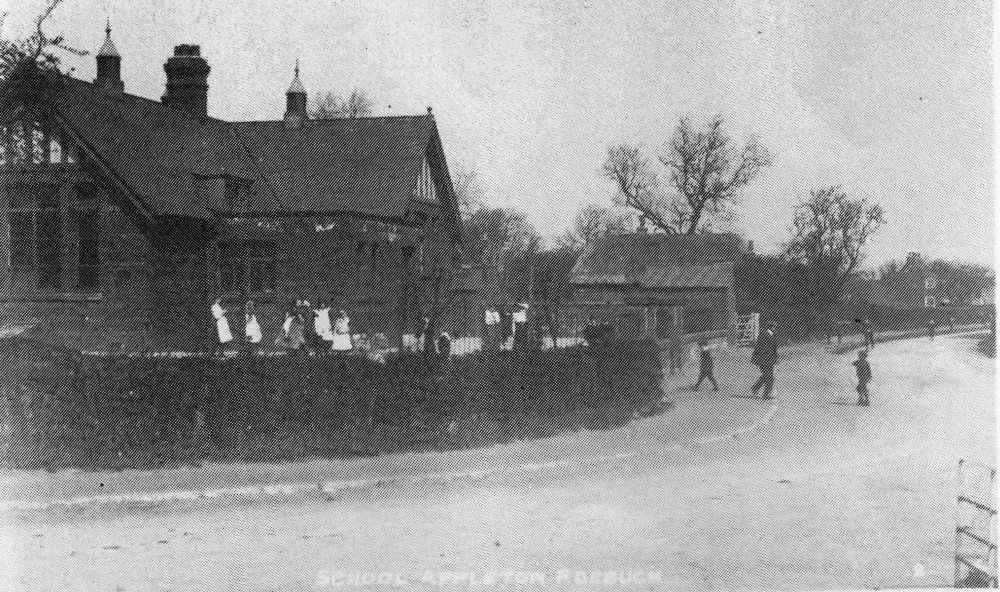 Children around pump on Home Green